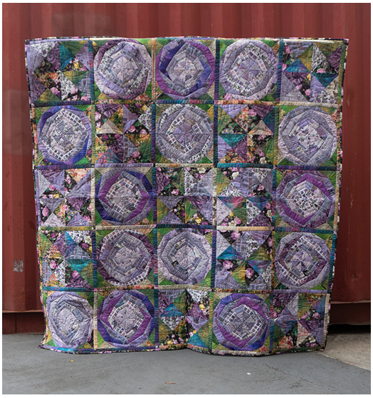 Quilt made from purple fabrics, by foundation piecing
