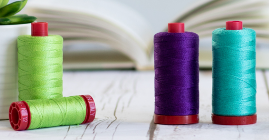 4 Aurifil thread spools 12 weight, green, purple and blue