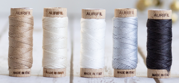 5 spools of stranded Aurifil Aurifloss thread in neutral colours