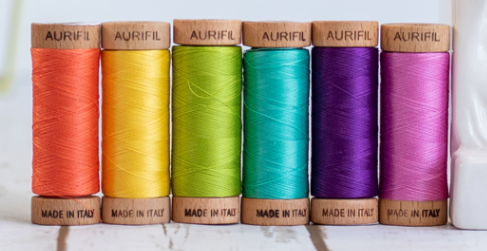 6 spools of Aurifil 80 weight thread in rainbow colours